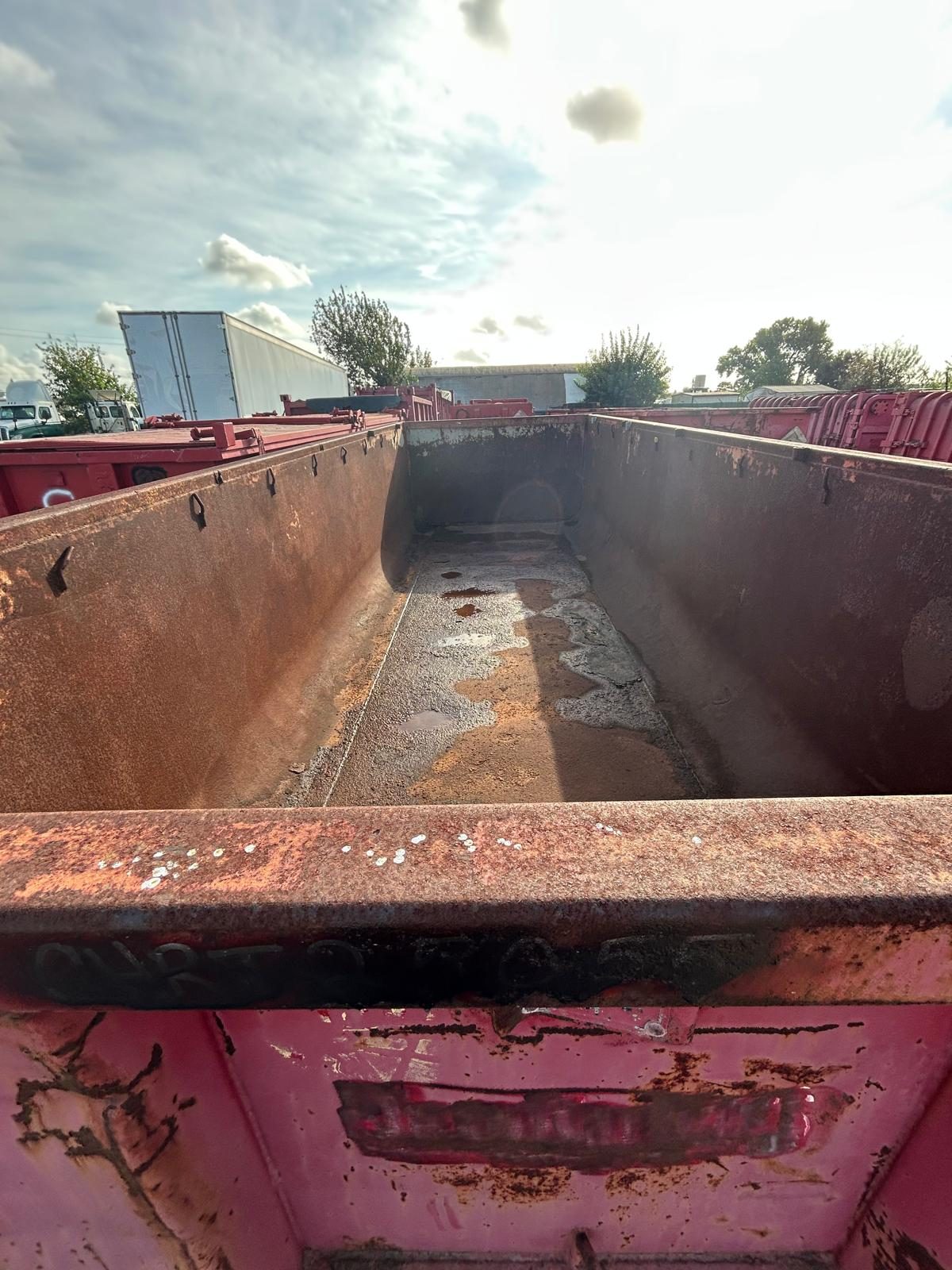 Interior and floor of a used open top roll-off