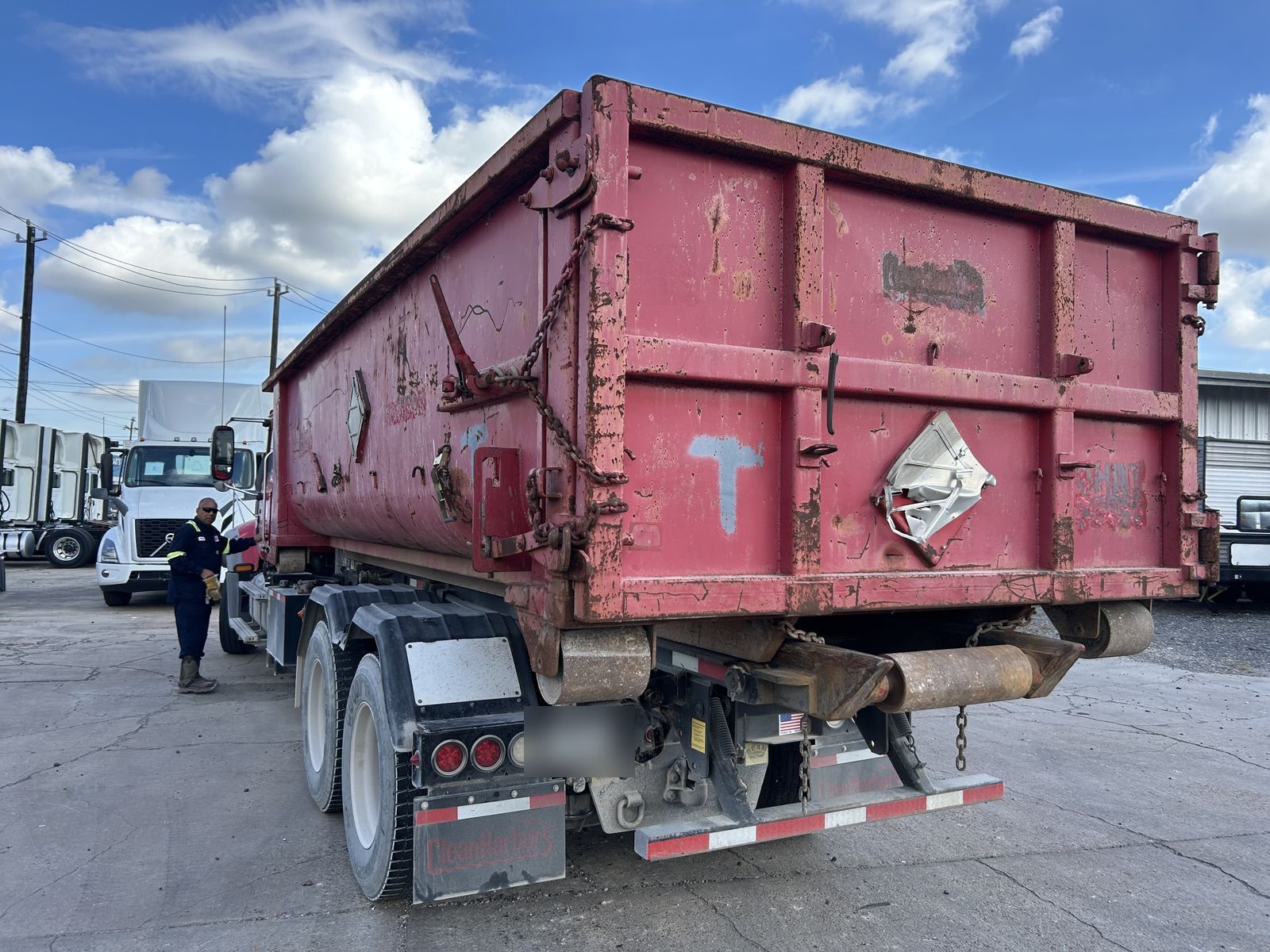 Used open top roll-off on a truck, rear view