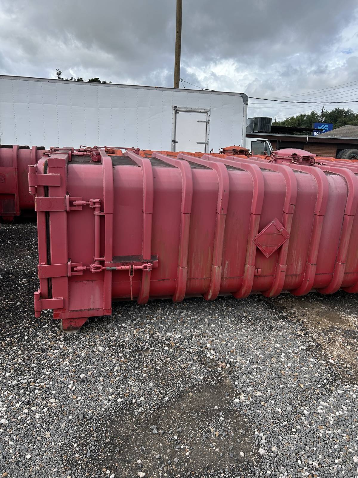 Rear door with ratchet binders on a used Roll-Off Vacuum Tank